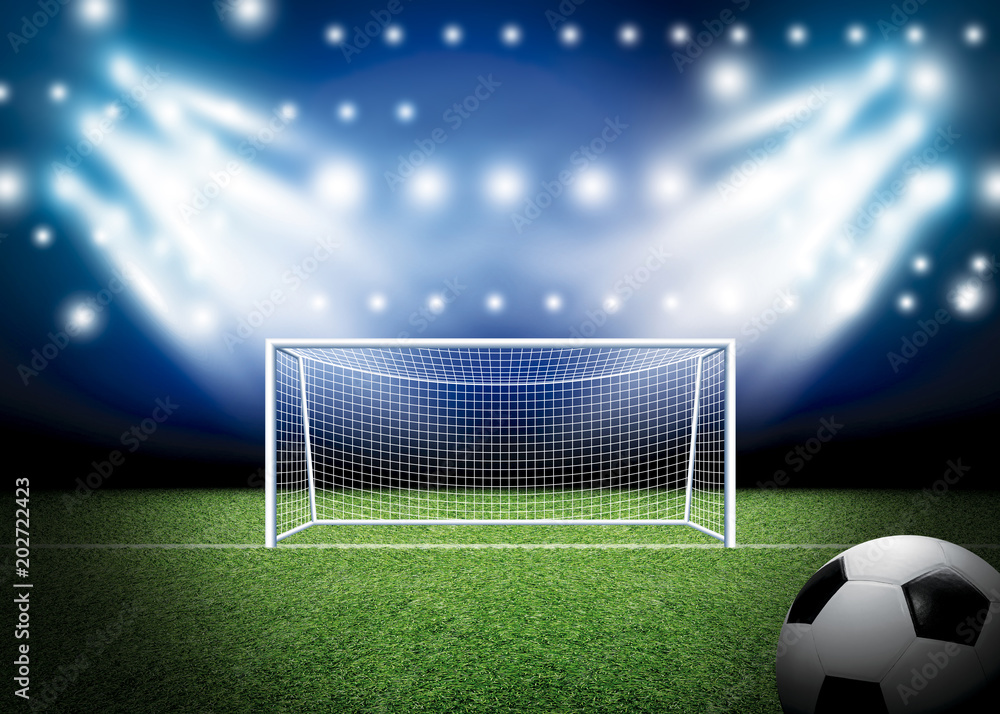 Soccer goal and football with spotlight background in stadium Stock