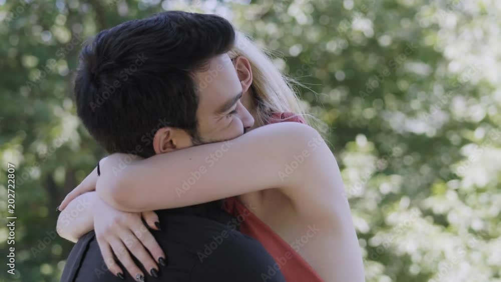 passionate embrace between lovers in the park passionate embrace between lovers in the park