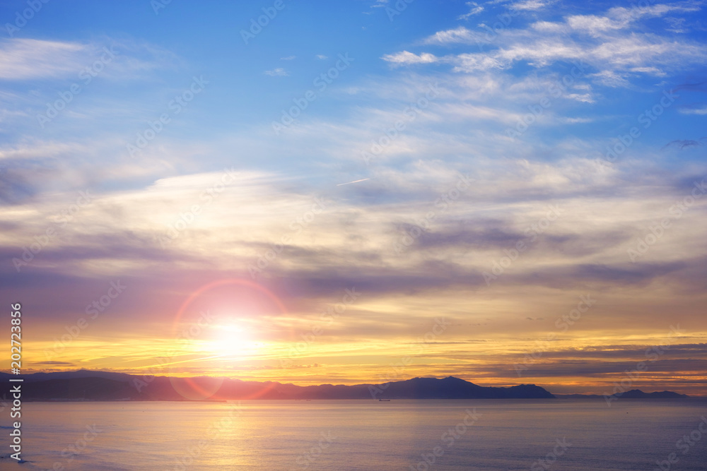 Panorama of beautiful sunset on the ocean.