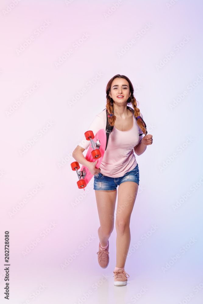 beautiful woman with skate in studio beautiful woman with skate in studio