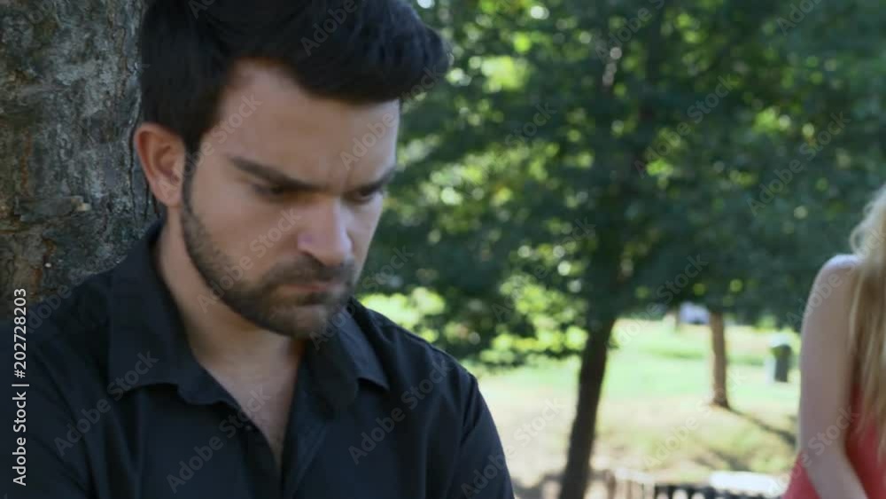 betrayal, anger, crisis - sad couple at the park betrayal, anger, crisis - sad couple at the park