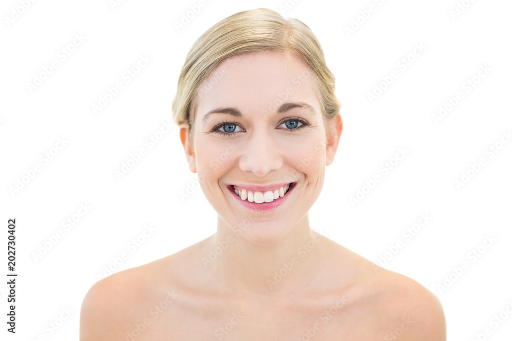 Cheerful young blonde woman posing smiling at camera Cheerful young blonde woman posing smiling at camera
