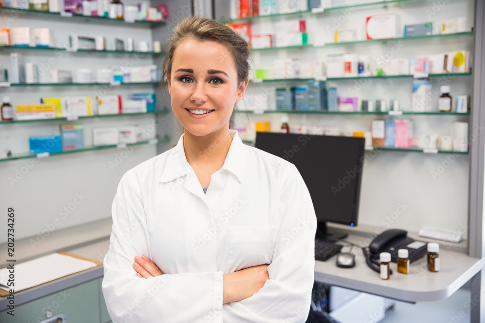 Junior pharmacist smiling at camera Junior pharmacist smiling at camera