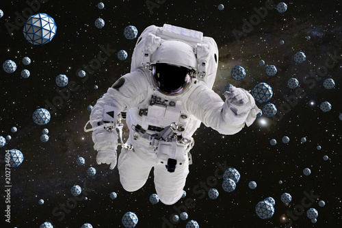 astronaut flying between abstract geometric objects with starry background 