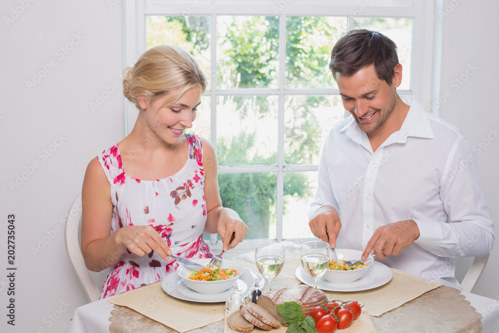Happy young couple having food Happy young couple having food