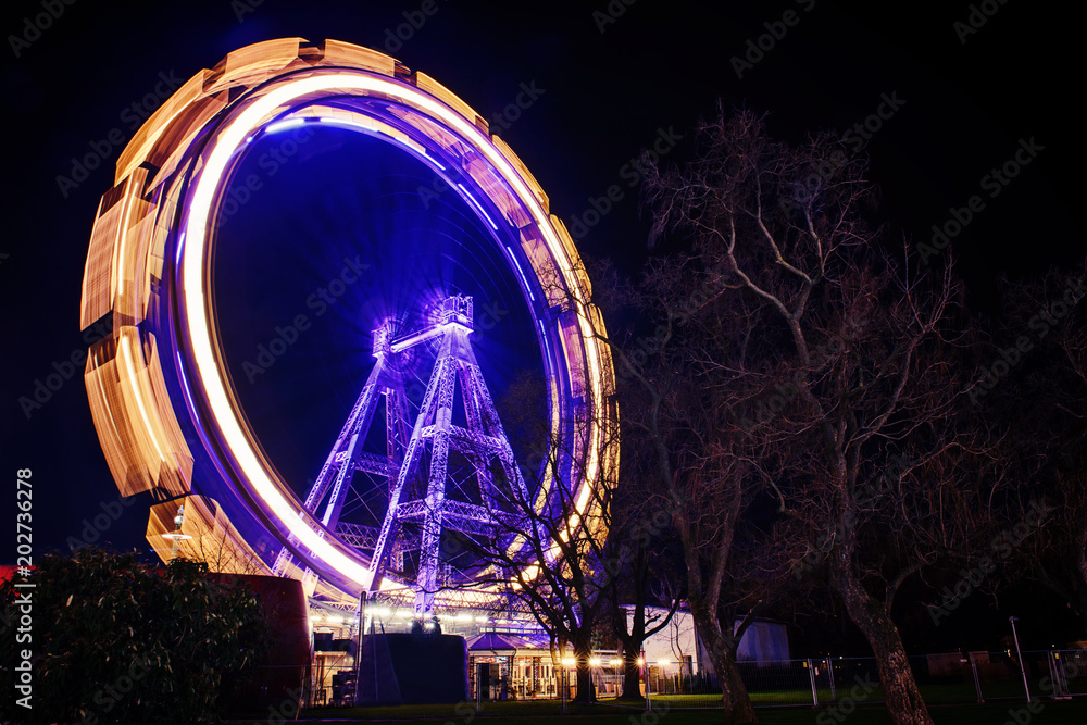 Ferris Wheel on Prater in Vienna Austria. Night Long exposure of a Ferris wheel in the amusement park. Family fun ride