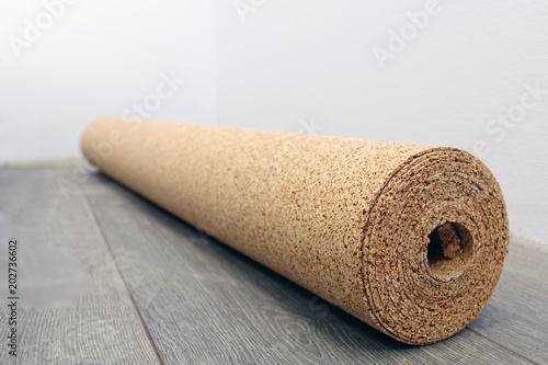 natural cork substrate on the floor with laminate photo