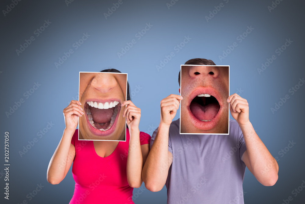 Φωτογραφία Close up of shocked man against grey vignette