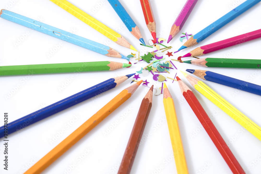 Many colored pencils in circle in a white background