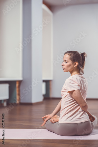 Attractive young woman doing yoga