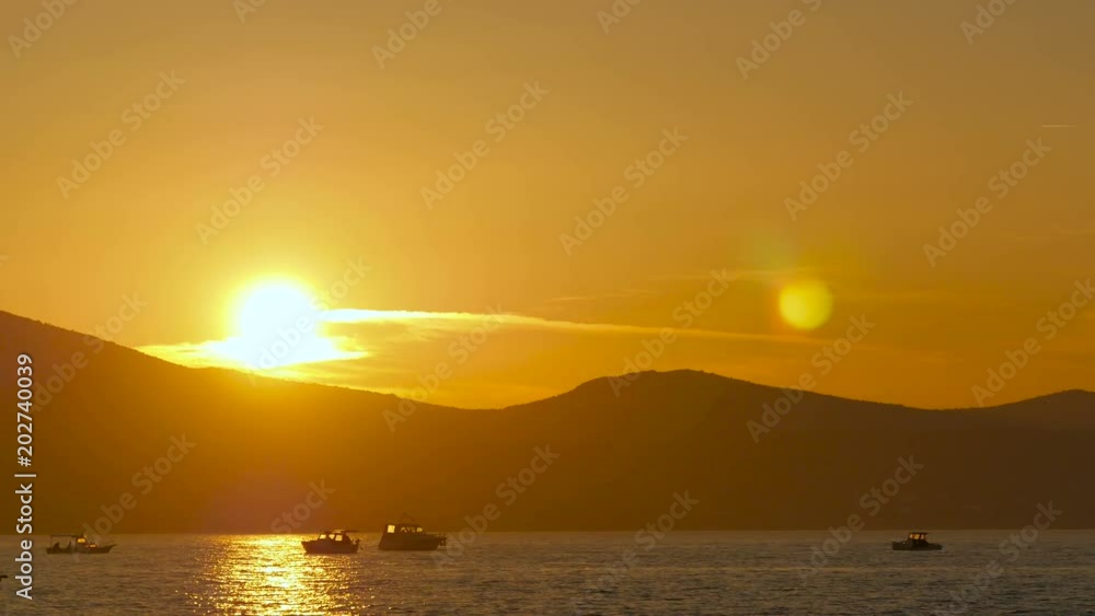 Boats floating on the sea at sunset Boats floating on the sea at sunset