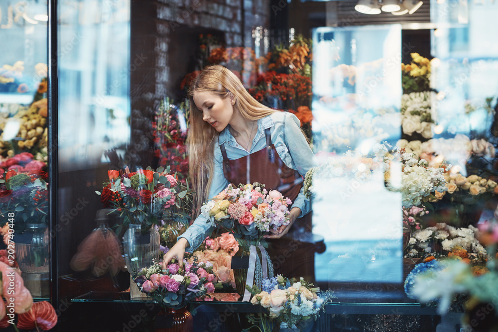 Working florist in a flower shop