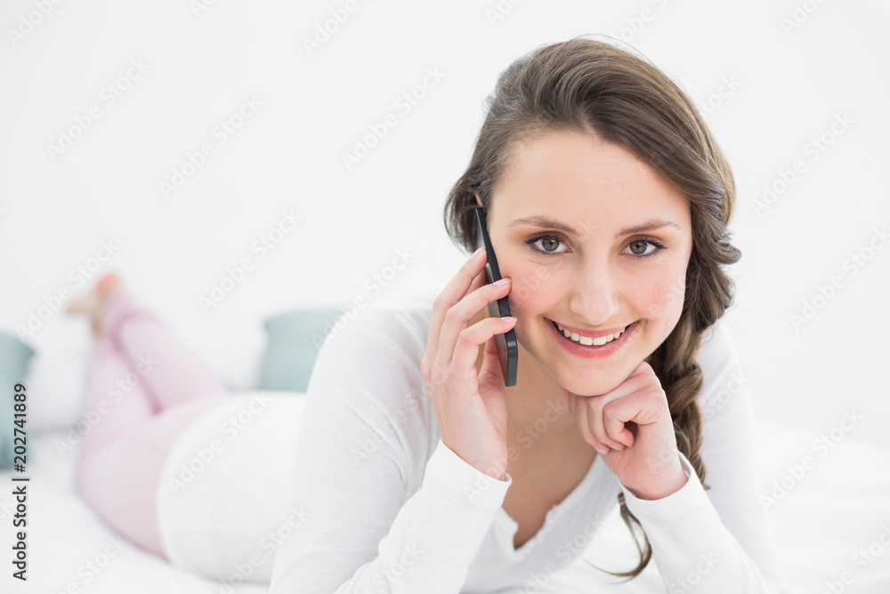 Beautiful woman using mobile phone in bed Beautiful woman using mobile phone in bed