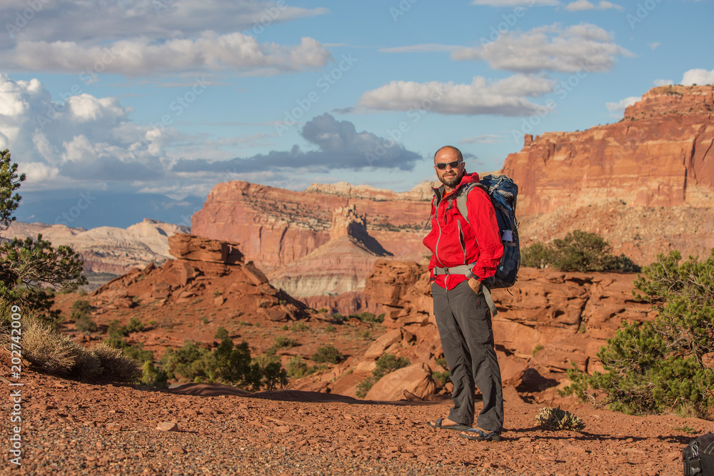 Hiker in Capitol reef National park in Utah, USA Hiker in Capitol reef National park in Utah, USA