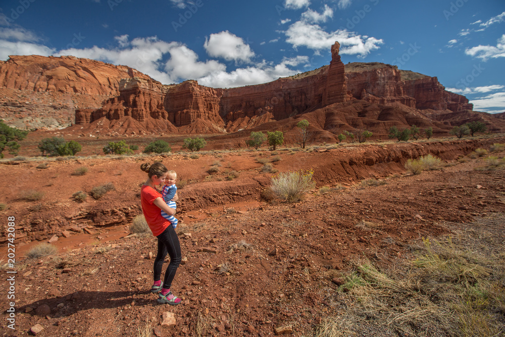 A mother and her baby son visit Capitol reef National park in Utah, USA