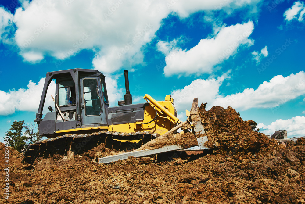 bulldozer earthmover working with clay or soil bulldozer earthmover working with clay or soil
