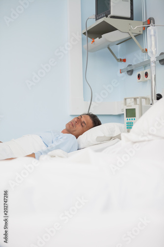 Patient sleeping while lying on a medical bed