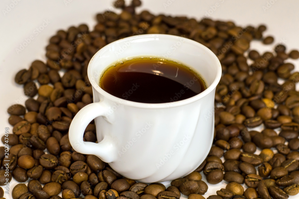 Coffee cup and coffee beans on white background Coffee cup and coffee beans on white background