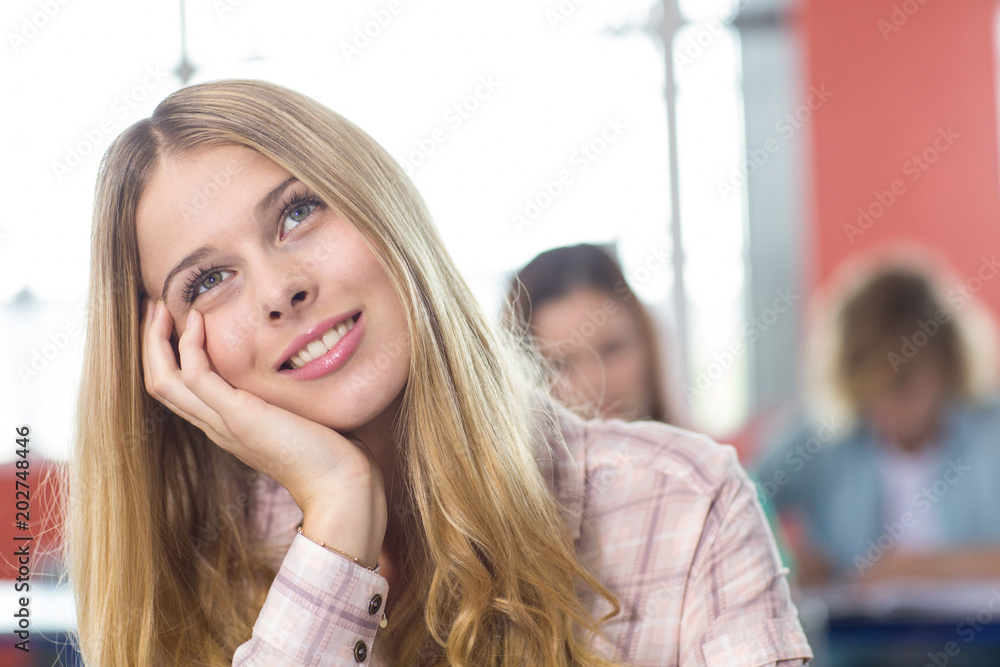 Thoughtful female student in classroom