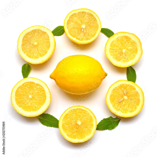 Lemon whole and sliced with leaves isolated on white background. Flat lay, top view