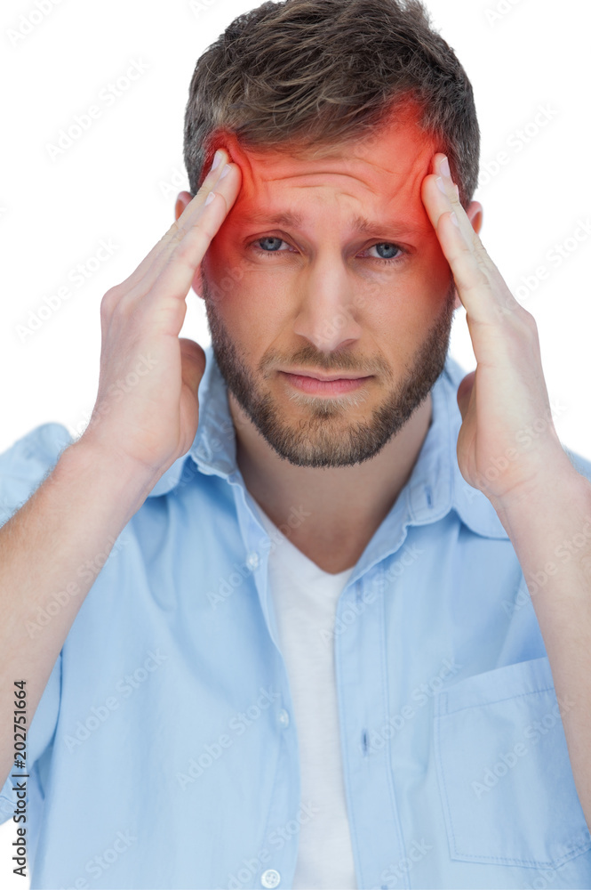Handsome model having headache on white background Handsome model having headache on white background