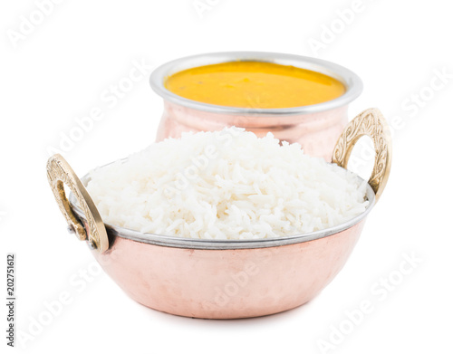 Indian Traditional Cuisine Dal Fry or Rice Also Know as Dal Chawal, Daal Chawal, Dal Rice, Whole Yellow Lentil with Rice or Dal Tadka, Daal Fry Served with Rice isolated on White Background photo