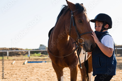 Boy sitting on the horse back © WavebreakmediaMicro