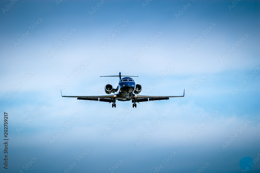 Luxurious black jet coming in for landing. Luxurious black jet coming in for landing.