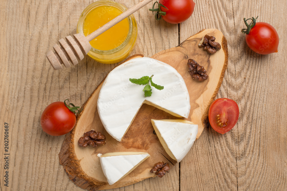 Camembert cheese, basil, cherry tomatoes and honey Camembert cheese, basil, cherry tomatoes and honey