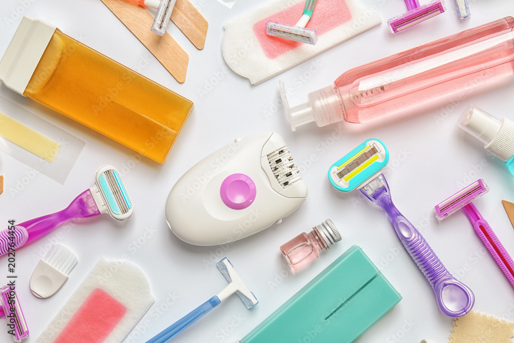 Set for epilation on white background, flat lay Set for epilation on white background, flat lay
