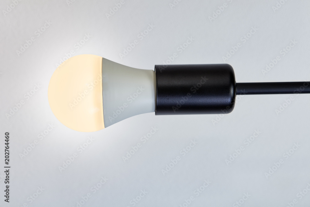 Fototapeta premium Bulb holder with black metal extension and LED lamp.