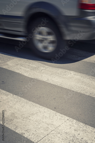 Fast car on a pedestrian crossing