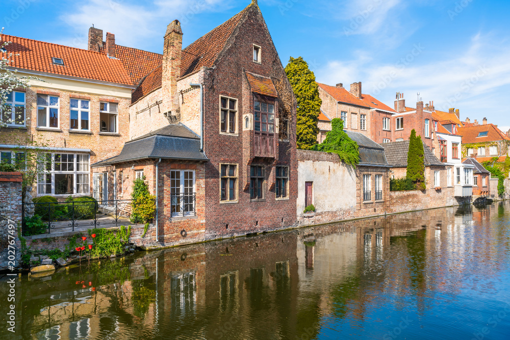 View of a canal and old historical buildings in Bruges, Belgium