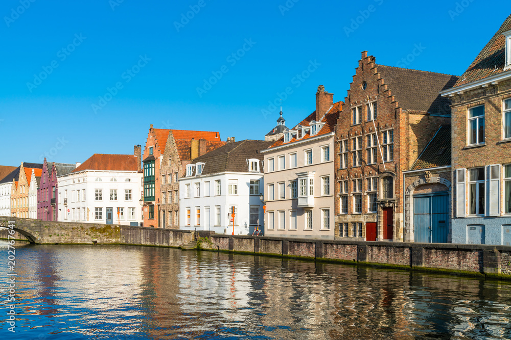 View of a canal and old colorful buildings in Bruges, Belgium