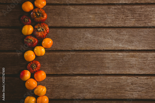 Candies with small pumpkins arranged on table