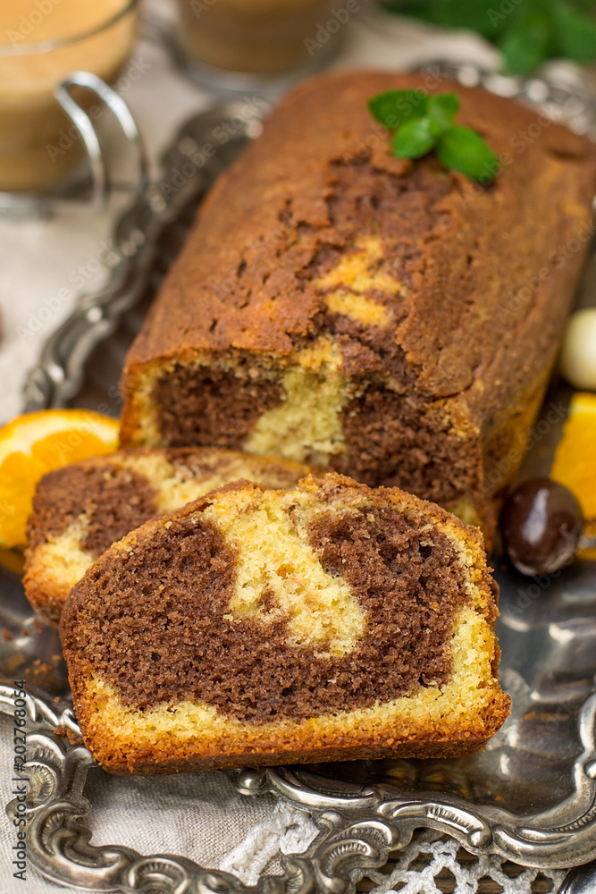 Chocolate and orange marble cake served with coffee Chocolate and orange marble cake served with coffee