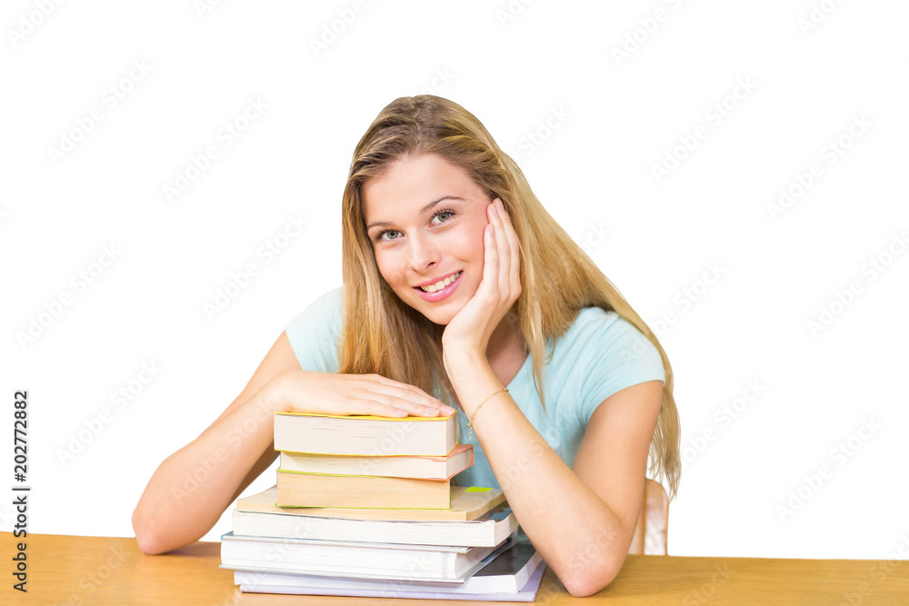 Portrait of female student in library against white background with vignette Portrait of female student in library against white background with vignette