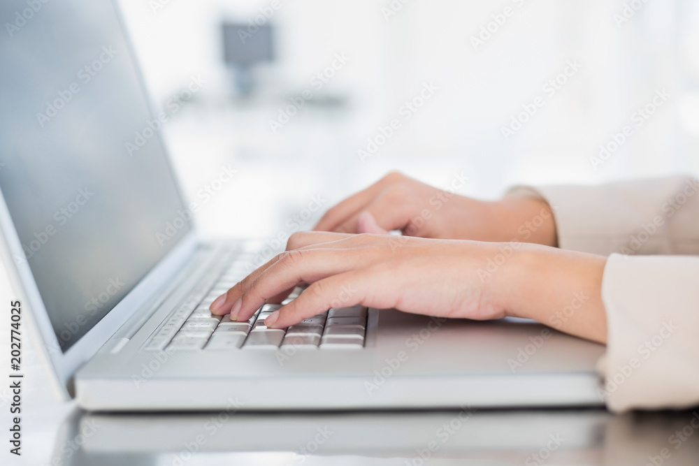 Close up of a businesswoman typing on a laptop Close up of a businesswoman typing on a laptop