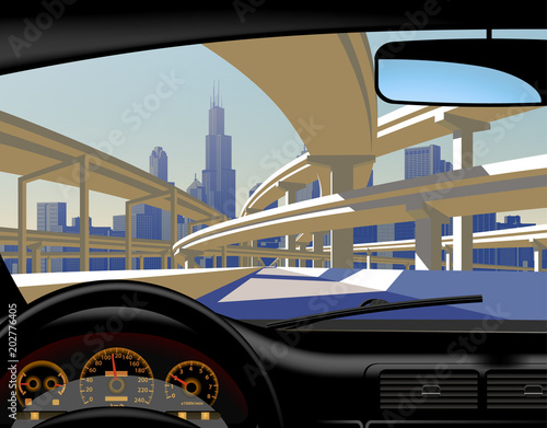 View from inside the car on the highway overpass and city skyline