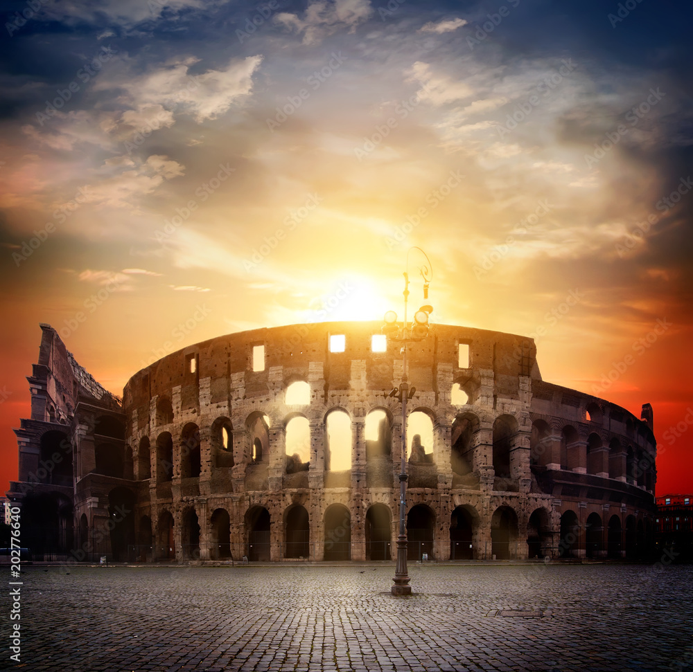 Colosseum and sunny sunrise