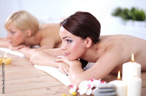 Two young beautiful women relaxing and enjoying at the spa. Two young beautiful women relaxing