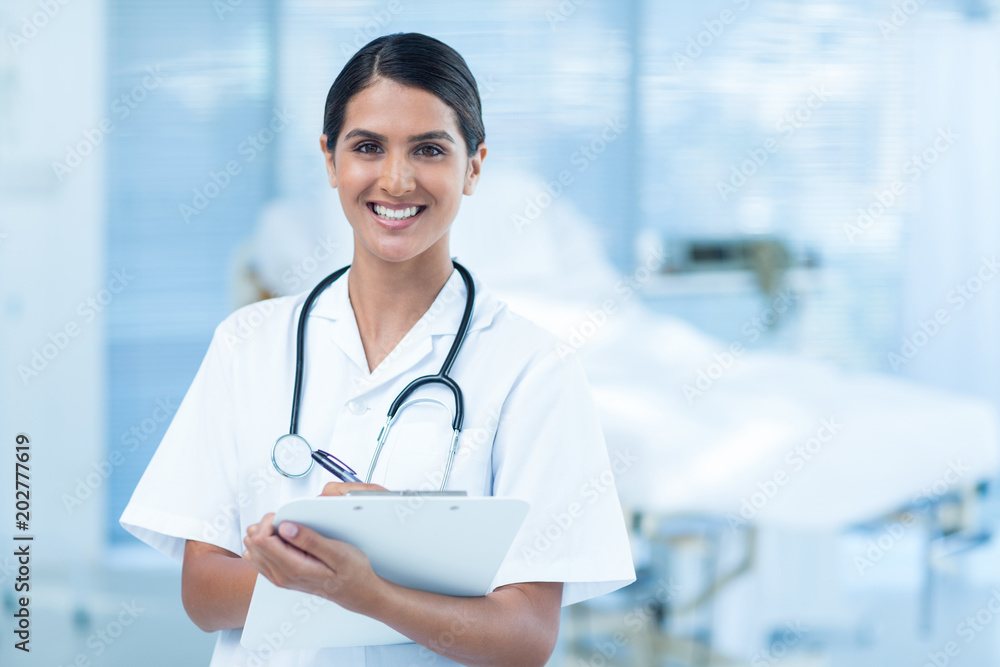 Beautiful smiling doctor looking at camera Beautiful smiling doctor looking at camera