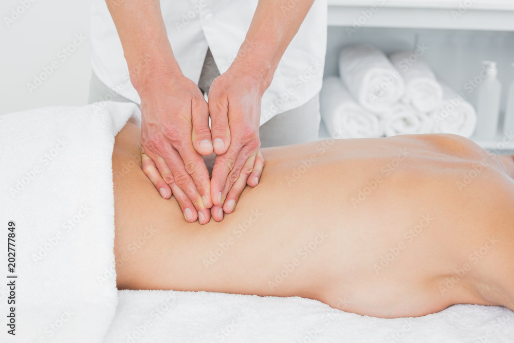 Fototapeta premium Closeup of a physiotherapist massaging womans back
