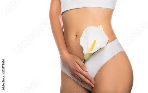 woman dressed in white panties, holding a white flower in her hands, close-up. female health, reproductive, gynecology isolated on white photo