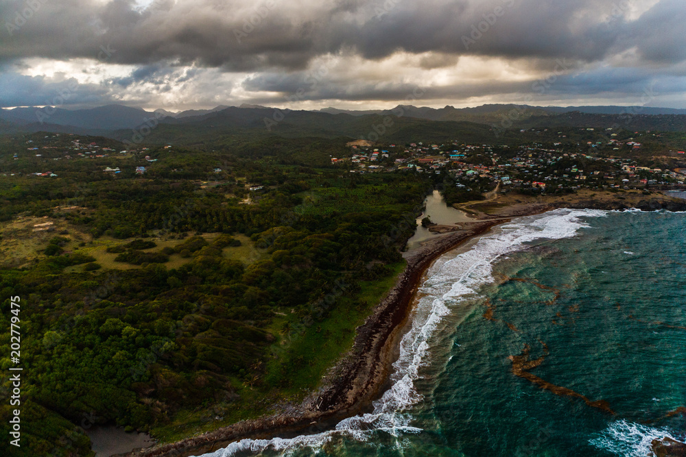 Aerial View of Hills, Valleys and a Rustic Caribbean Beach, in St. Lucia