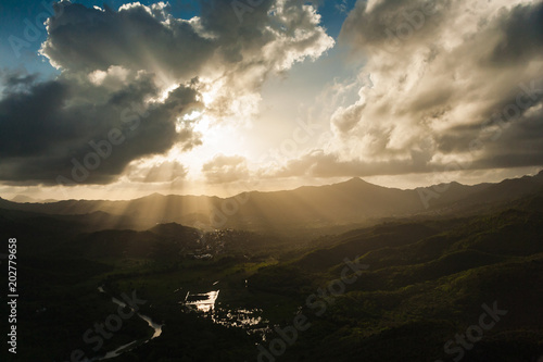 Aerial View of a Sun Beams, Clouds Mountains and Valley at Sunset, in St. Lucia