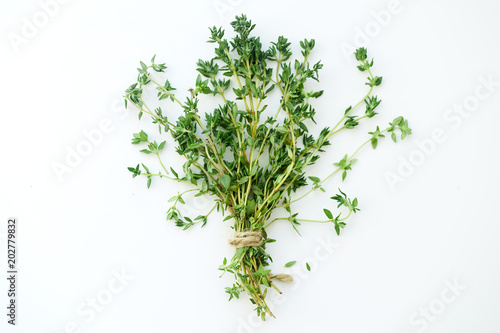 Fotografia Bouquet of fresh thyme twigs on white background with copy space