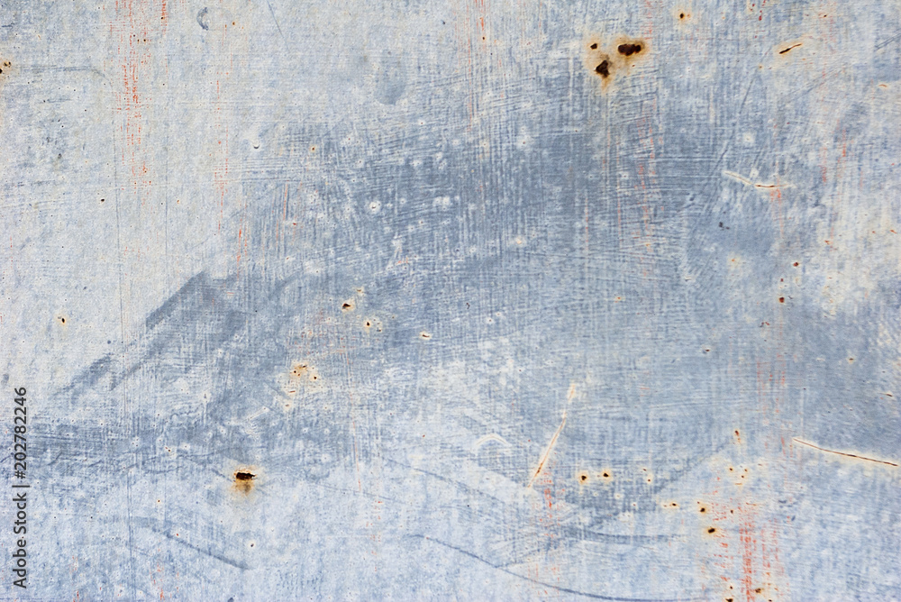 Fototapeta premium Unevenly colored wall. Paint smears on wall texture. Grey abstract background
