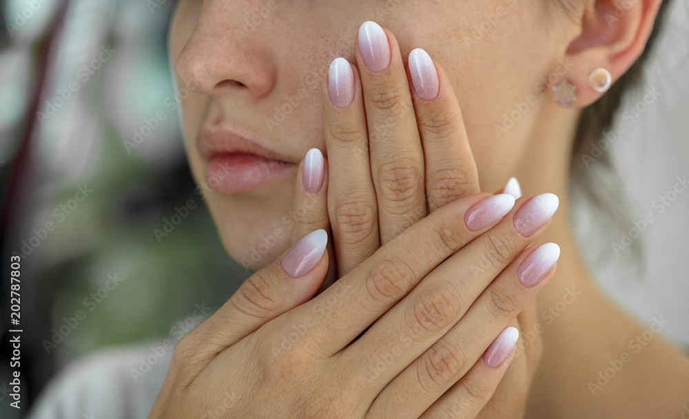 Beautiful woman's nails with beautiful french manicure ombre