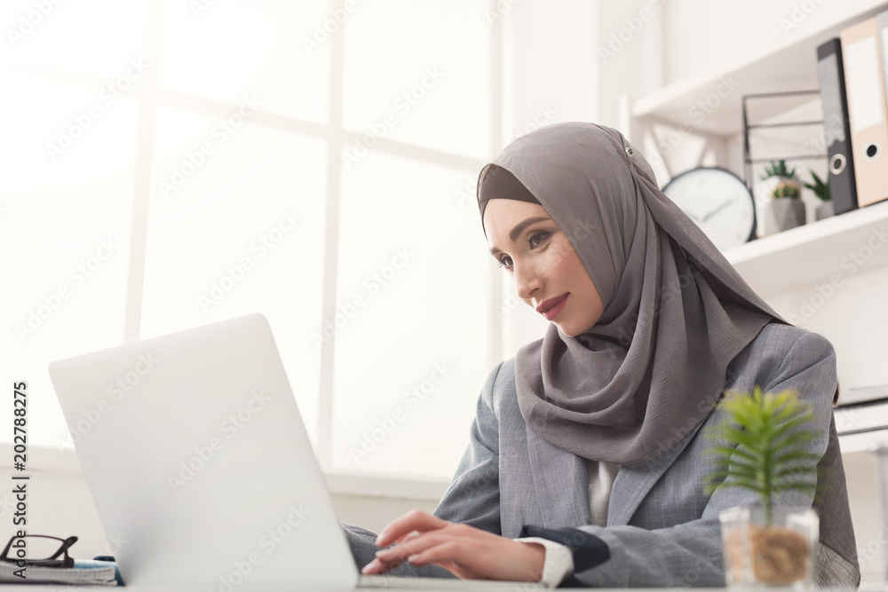 Arabic businesswoman in hijab working at office Arabic businesswoman in hijab working at office